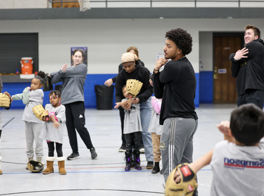 NWU softball and baseball players lead clinic with The Malone Center.